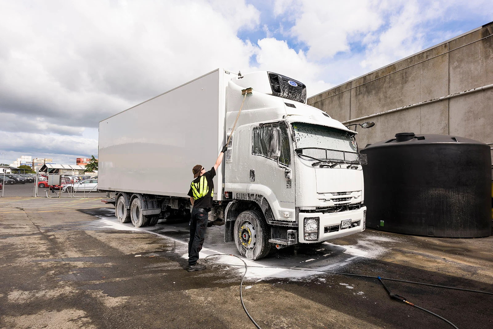 Water Conservation at TR Group - truck driver washing a truck