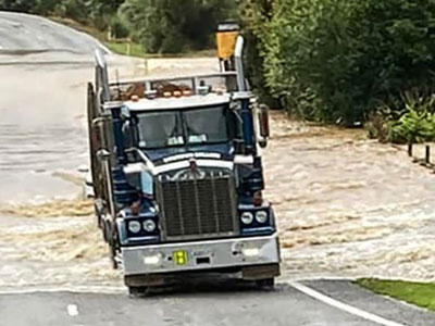 Truck driving through a flood